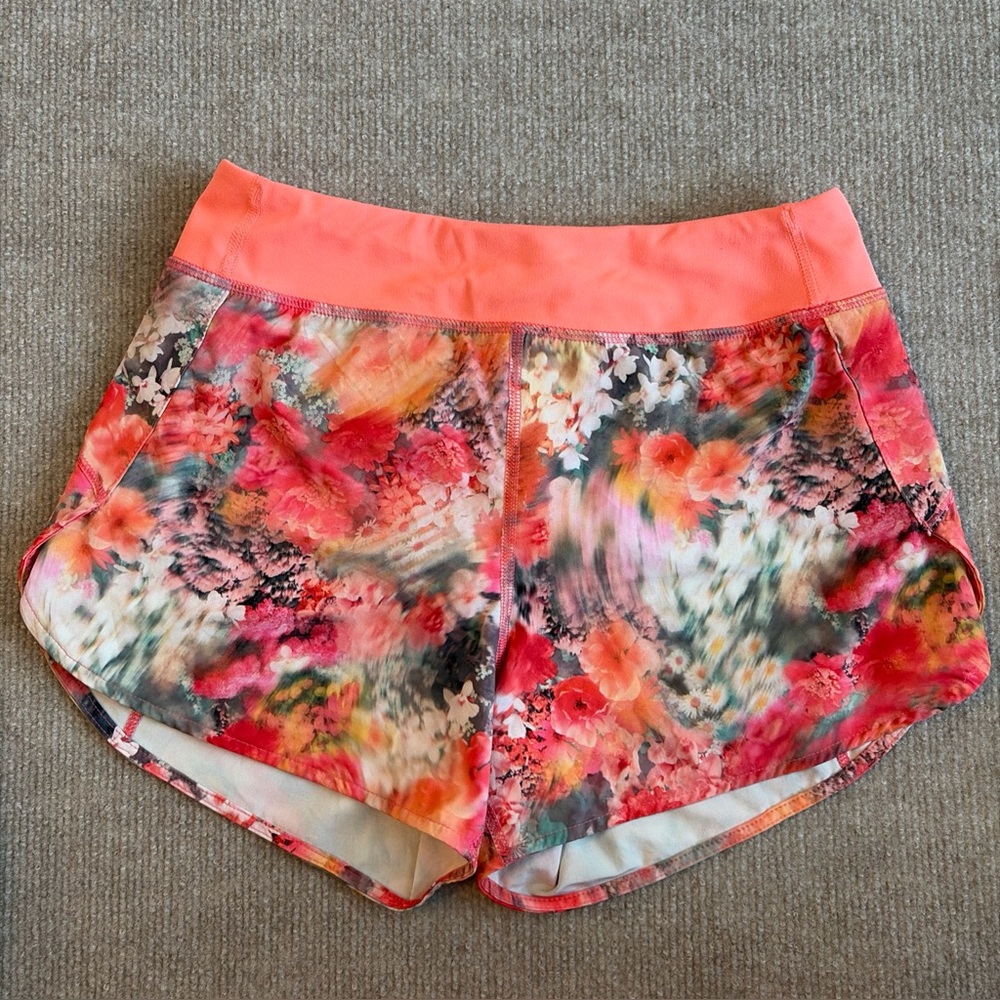 Athleta Girl Size L/12 Run the World 3" Shorts Orange Floral Print